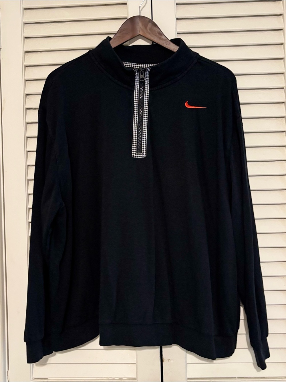Nike Black Long Sleeve Quarter-Zip Pullover with orange Swoosh